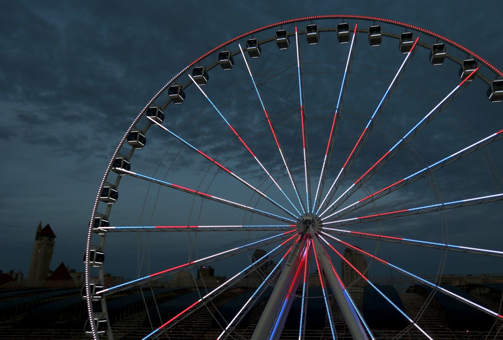 The St. Louis Wheel at Union Station lights up the sky